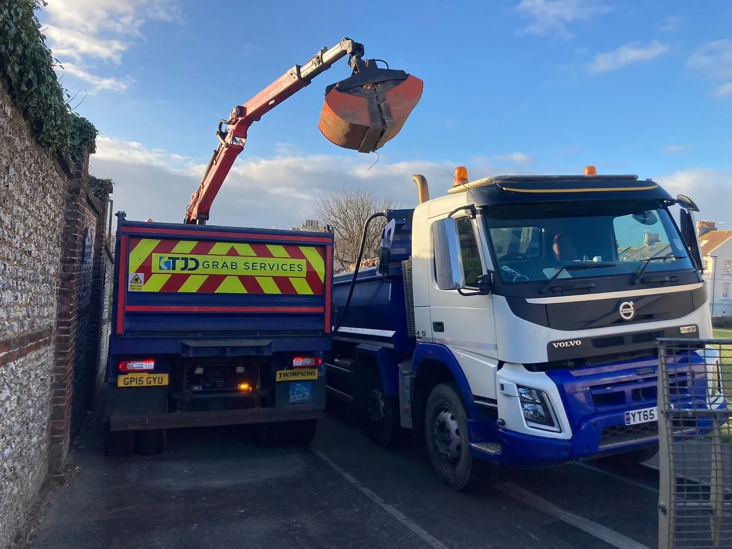 A truck with a crane on the back of it.